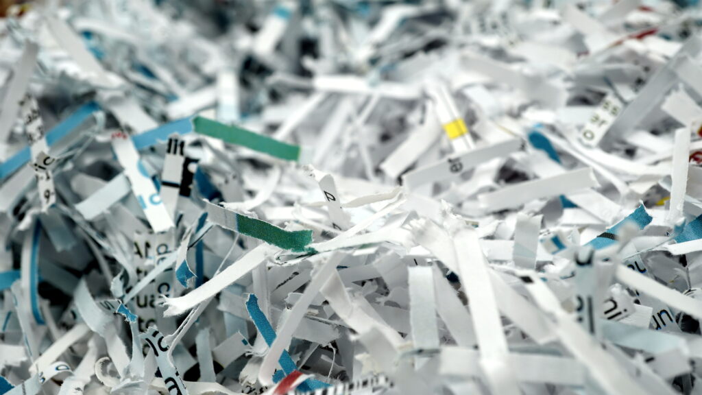 paper scraps of shredded documents seen in detail. Conceptual image for privacy